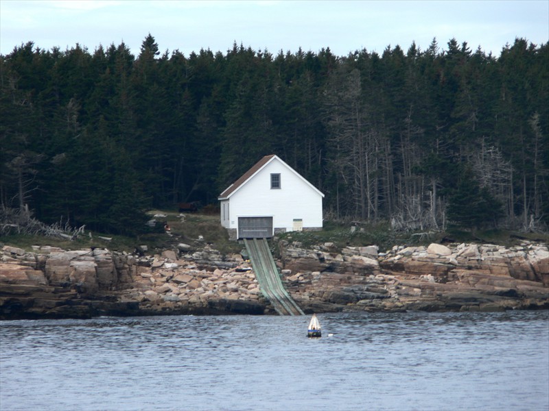 Boat house with ramp down to the water
